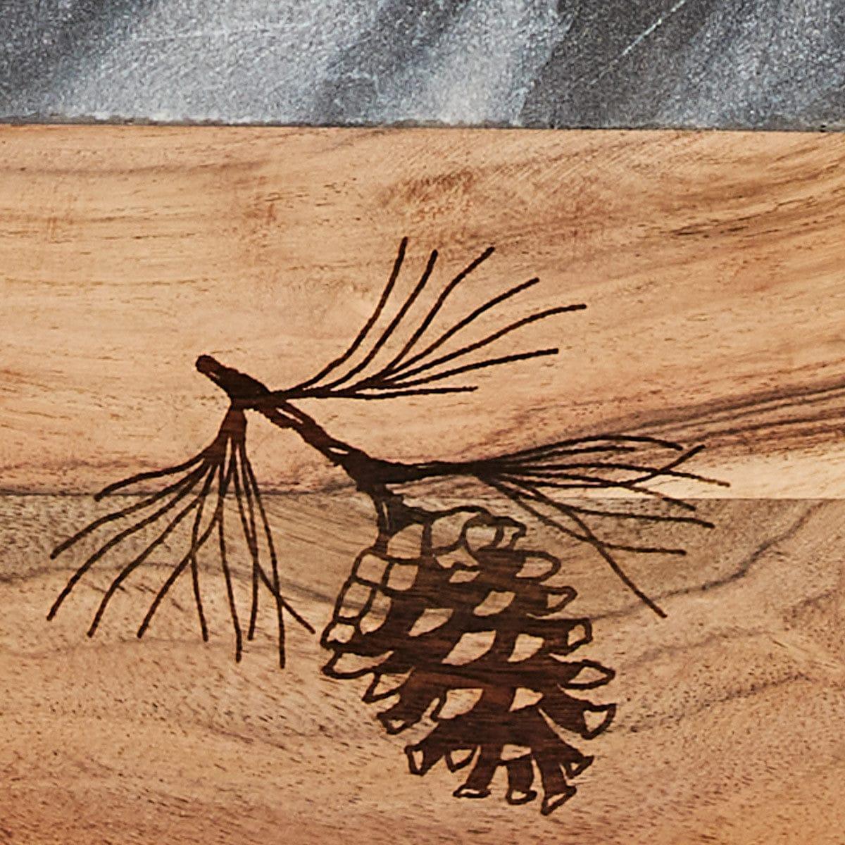 Engraved pine cone on wood and marble cutting board - Your Western Decor