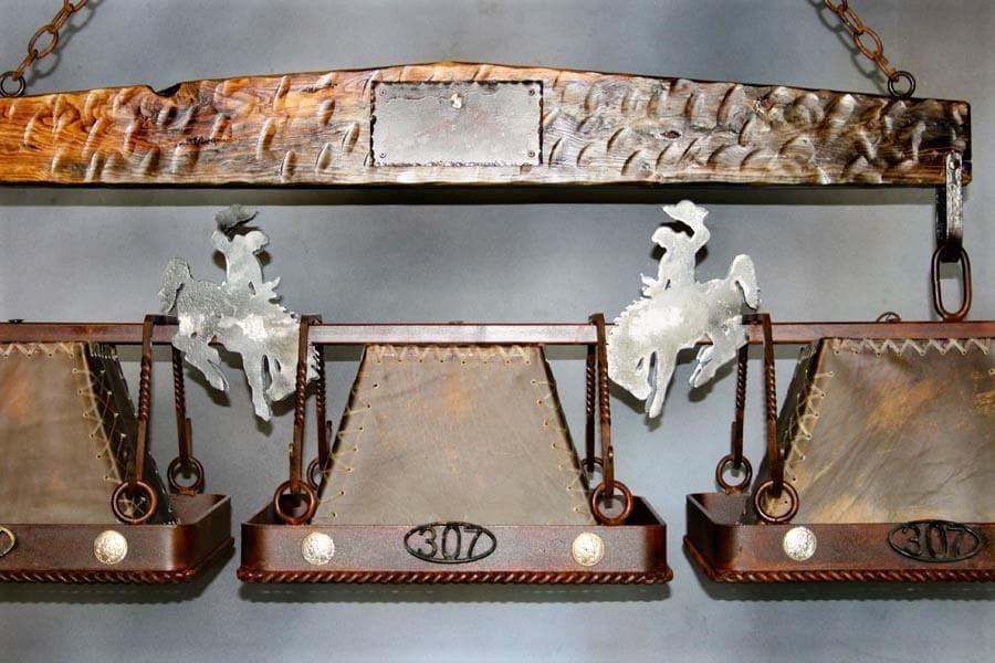 Wyoming Bronc, rawhide, iron & wood custom island light. Rustic, handmade in the USA. Free Shipping. Your Western Decor
