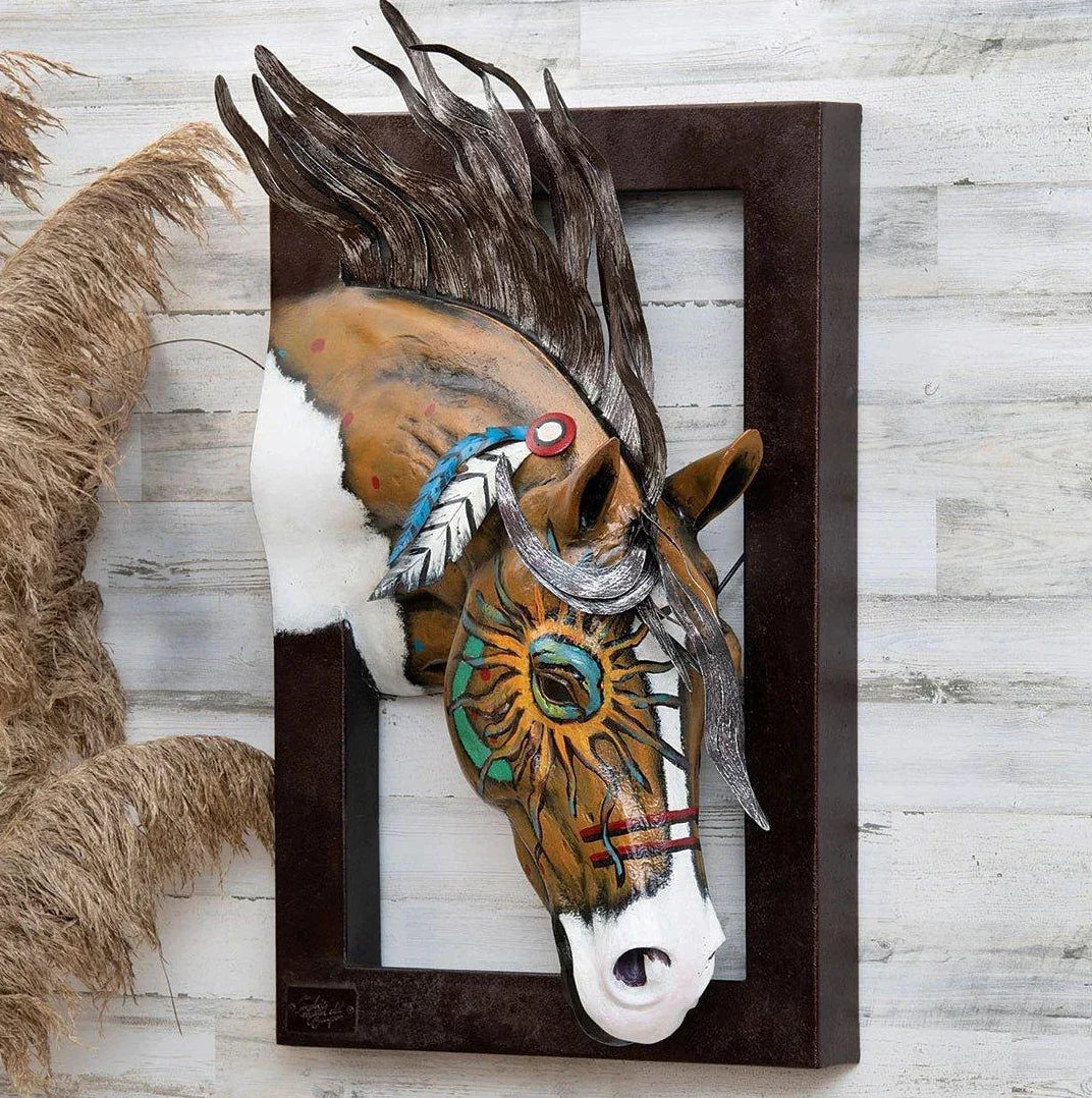 Image of metal horse head with tribal painting