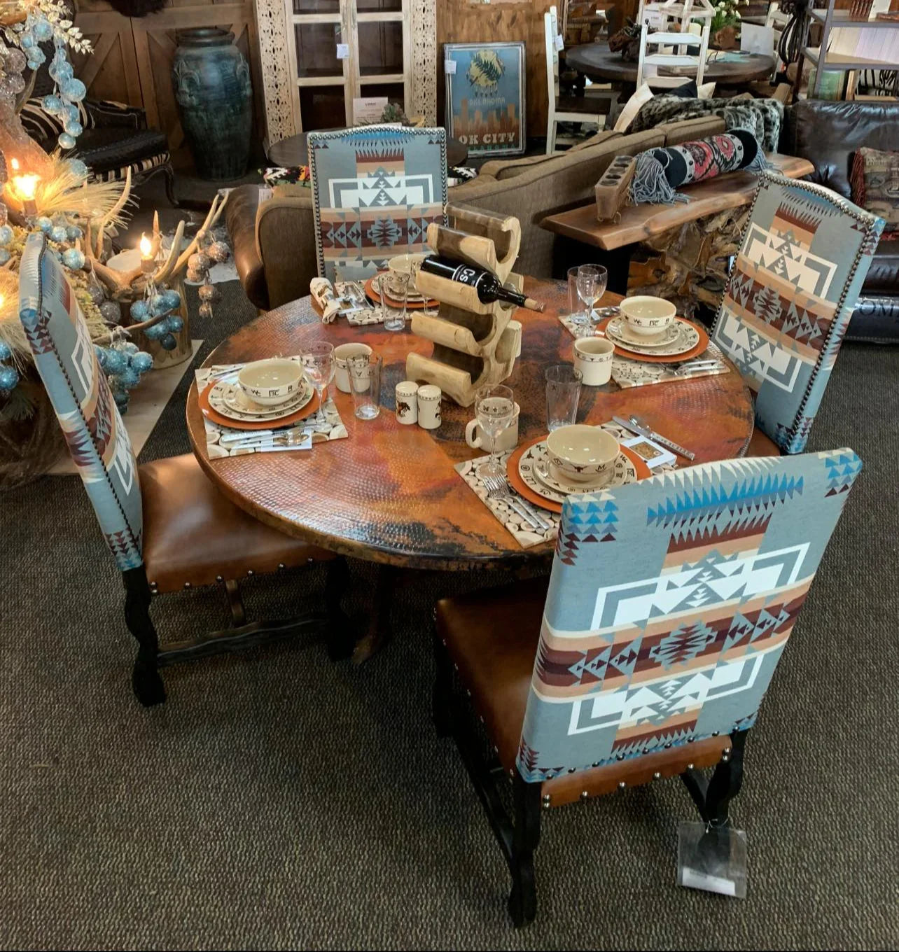 Chief Joseph fabric and leather dining chairs at dining table set in western tableware