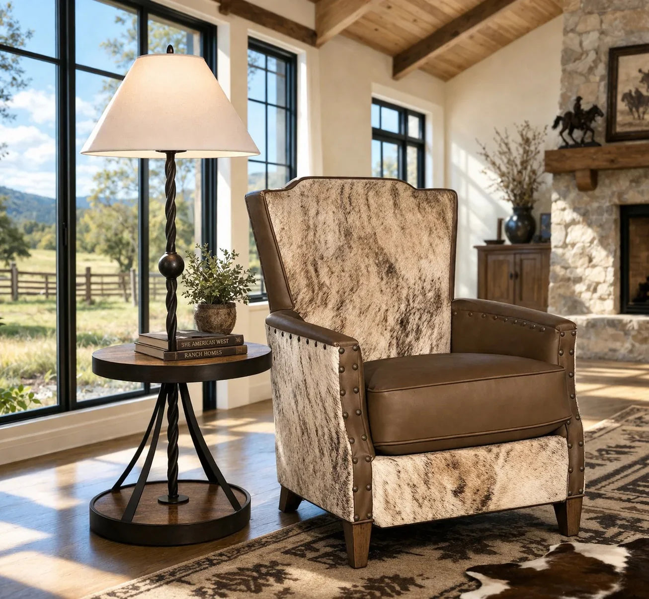 Western living room with large windows, rustic table lamp with shelf, and leather and cowhide lounge chair 