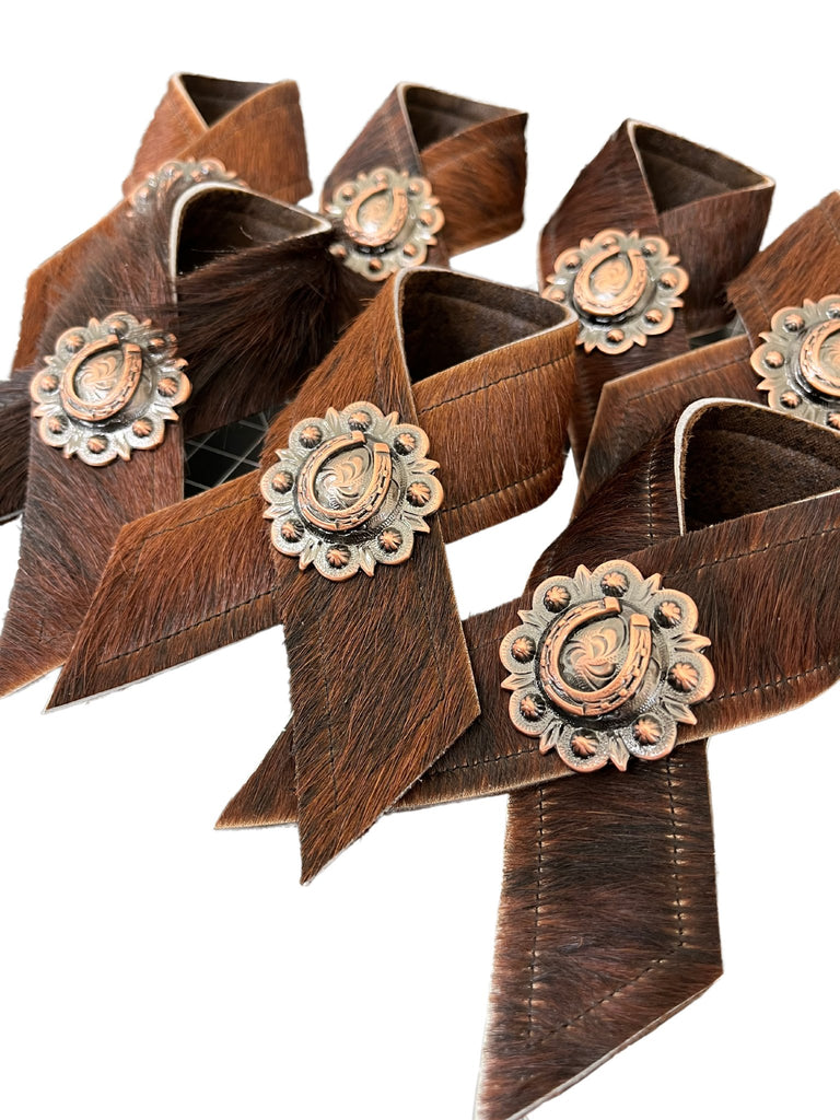 Brindle cowhide and horseshoe concho napkin rings handmade in the USA by Your Western Decor