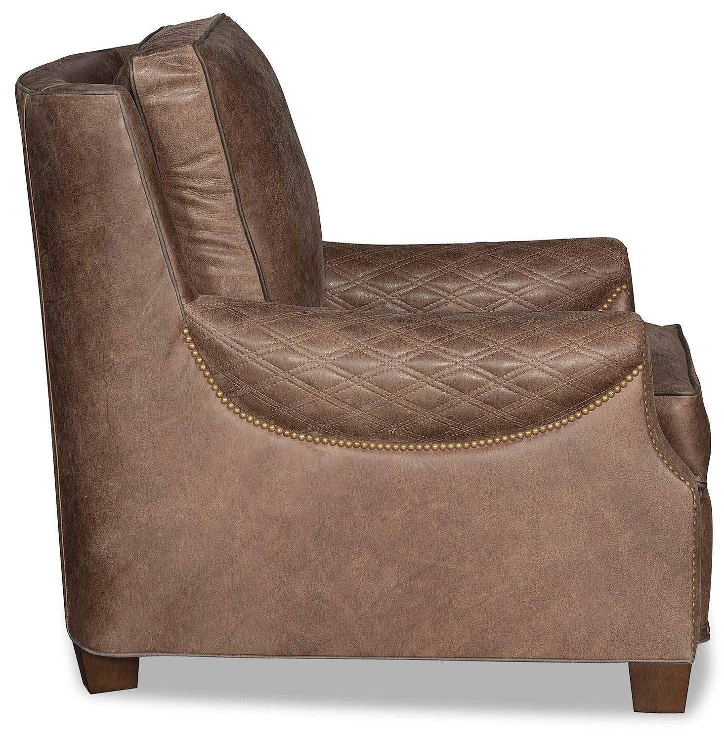 Brown leather armchair side showing quilted armrests - Your Western Decor