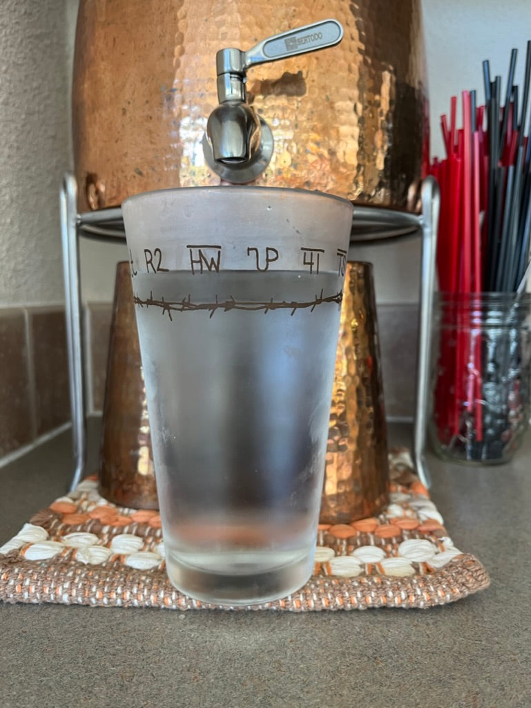Copper kitchen water dispenser with Your Western Decor's Branded Western Pint Glass 