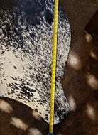 82" measurement of black and white peppered cowhide rug - Your Western Decor