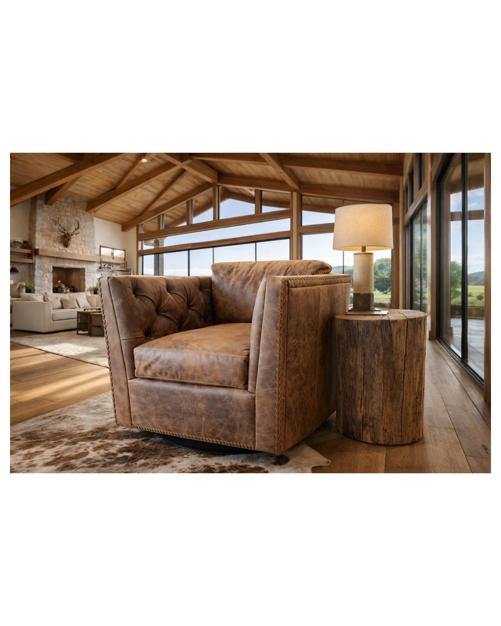 luxury western leather swivel chair in open ranch living room with high beam ceilings and floor to ceiling windows