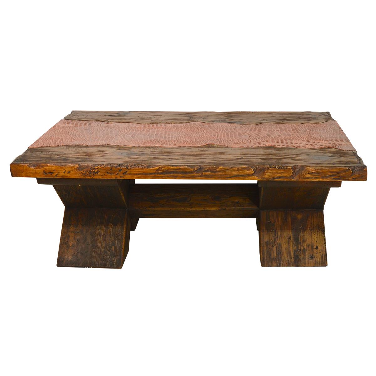 A rustic rectangular wooden coffee table with a thick live-edge top, a natural wood inlay running down the center, and block-style legs, shown against a plain white background.