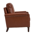 Side profile of Carson Brown Leather chair highlighting arm design, nailhead trim and solid wood legs