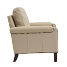Side profile of Carson camel Leather chair highlighting arm design, nailhead trim and solid wood legs