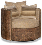 Front view of carter leather and fabric barrel swivel chair with 3 pillows and nail trim