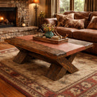 Cozy living room with a stone fireplace, wooden coffee table, and brown sectional sofa.