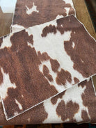 Brown and white cowhide print table runner and placemat - Your Western Decor