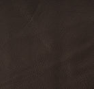A close-up of dark brown textured leather material with a pebbled grain pattern.
