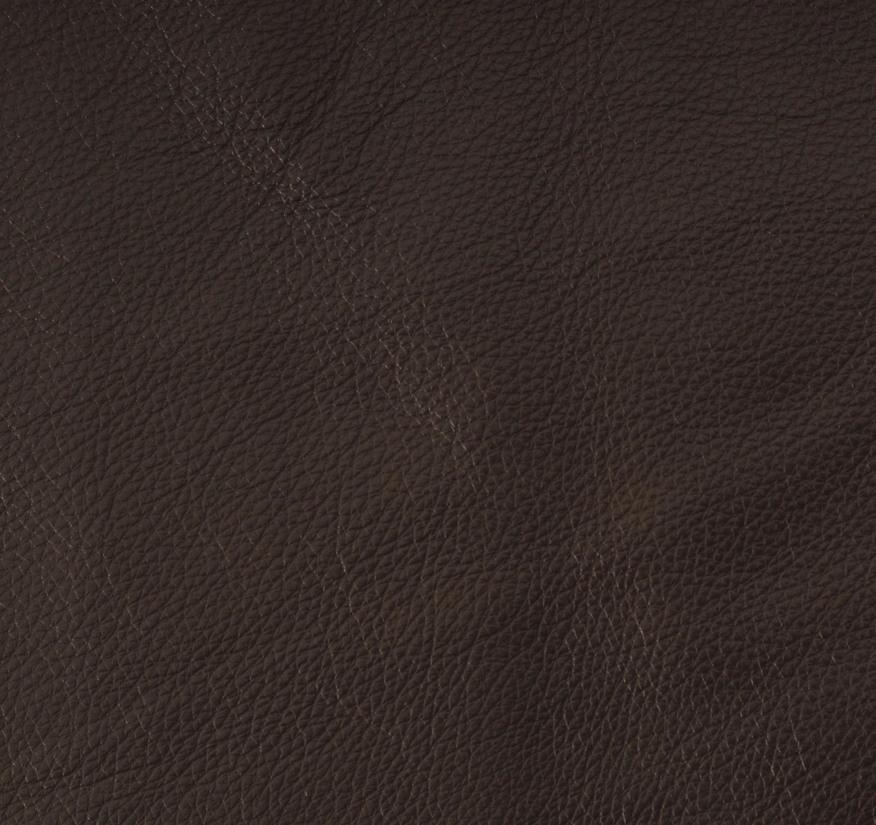 A close-up of dark brown textured leather material with a pebbled grain pattern.