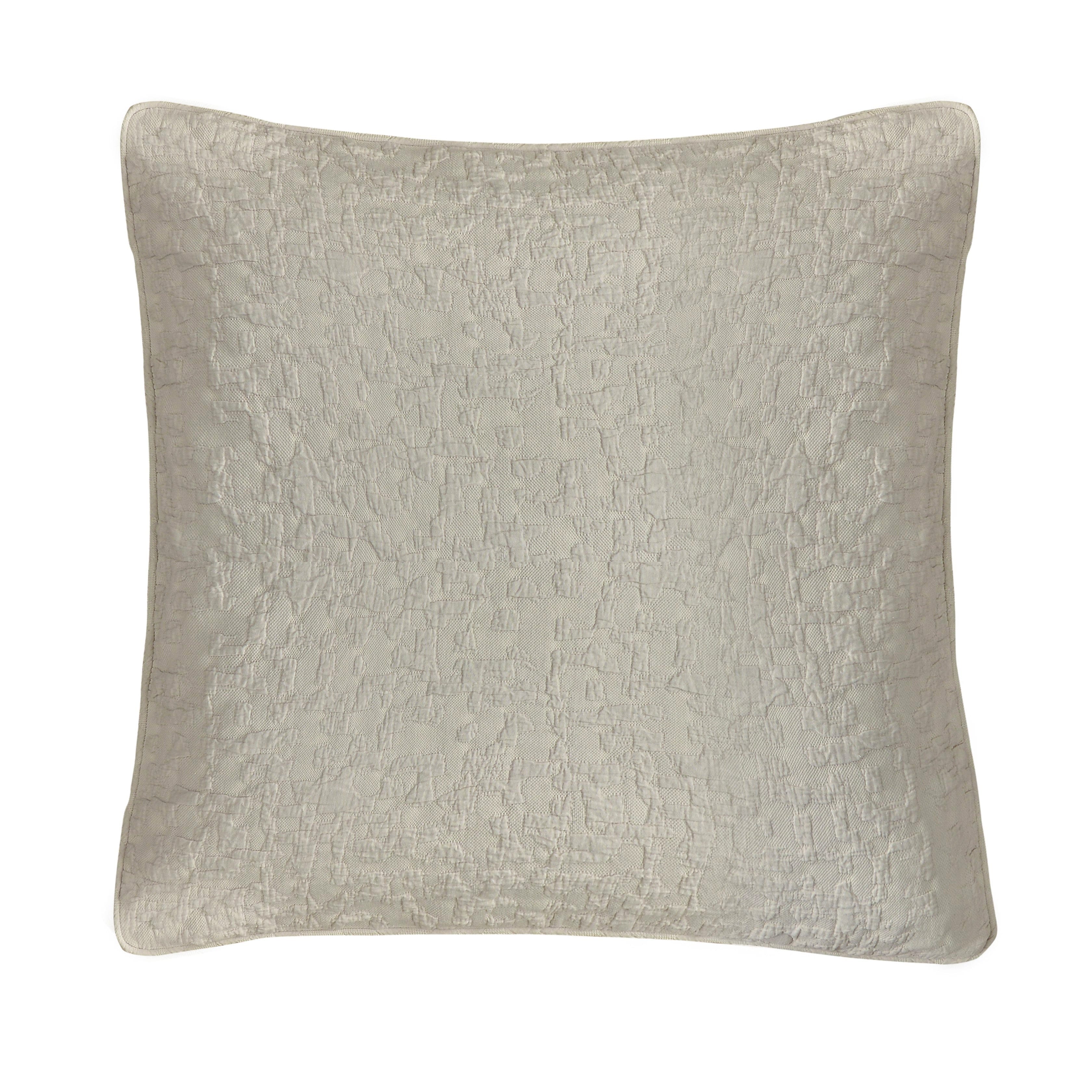 Textured beige pillow on a white background