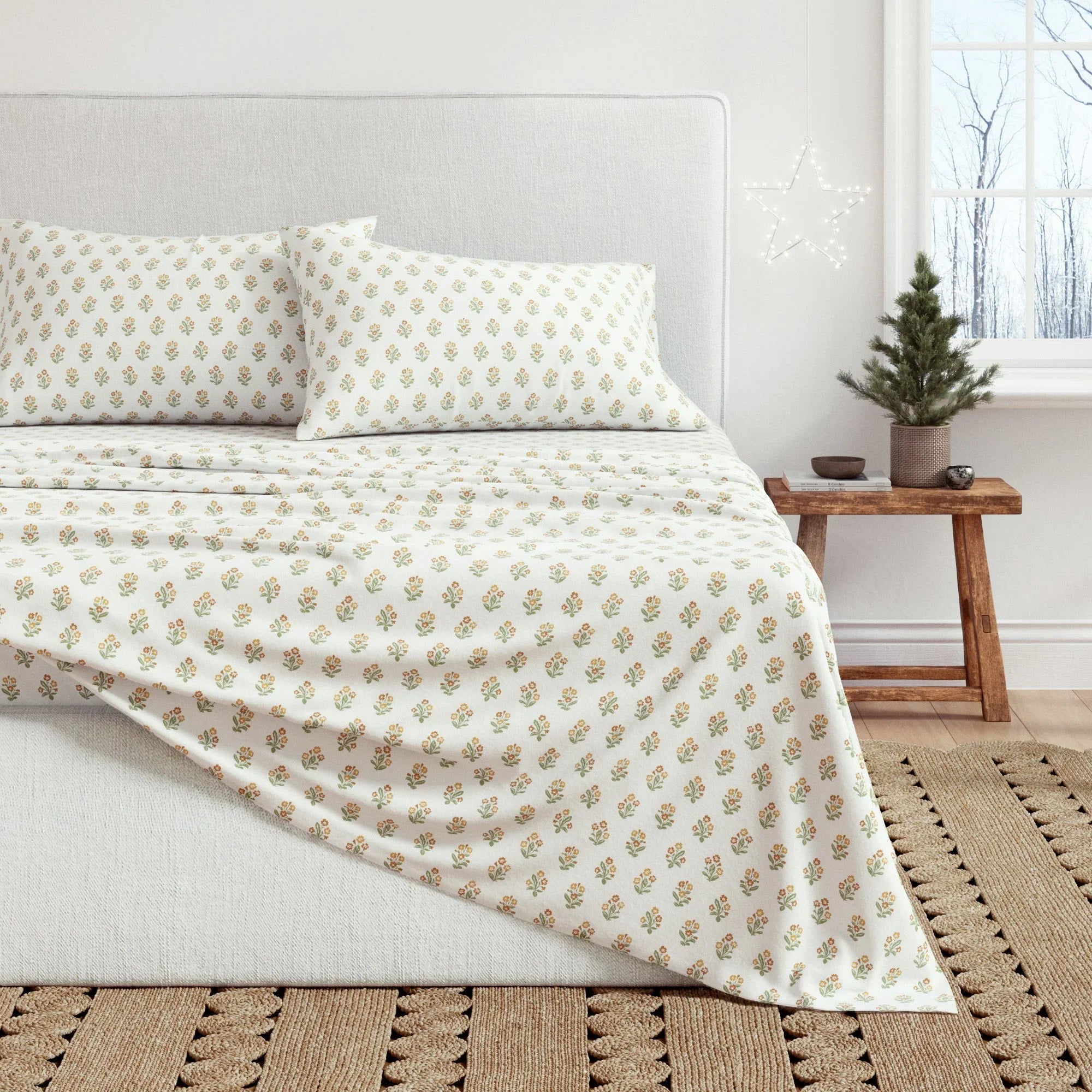 Bed with floral-patterned bedding in a bedroom setting
