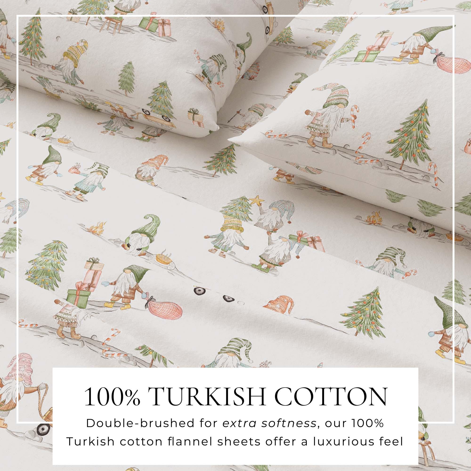 Flannel sheets with gnome and tree pattern on a white background, labeled as 100% Turkish cotton.