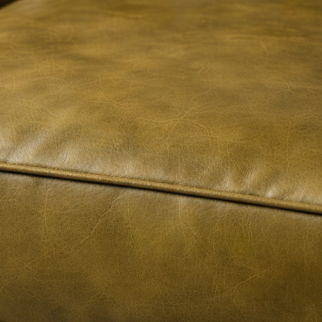 detail of olive green leather sofa seat