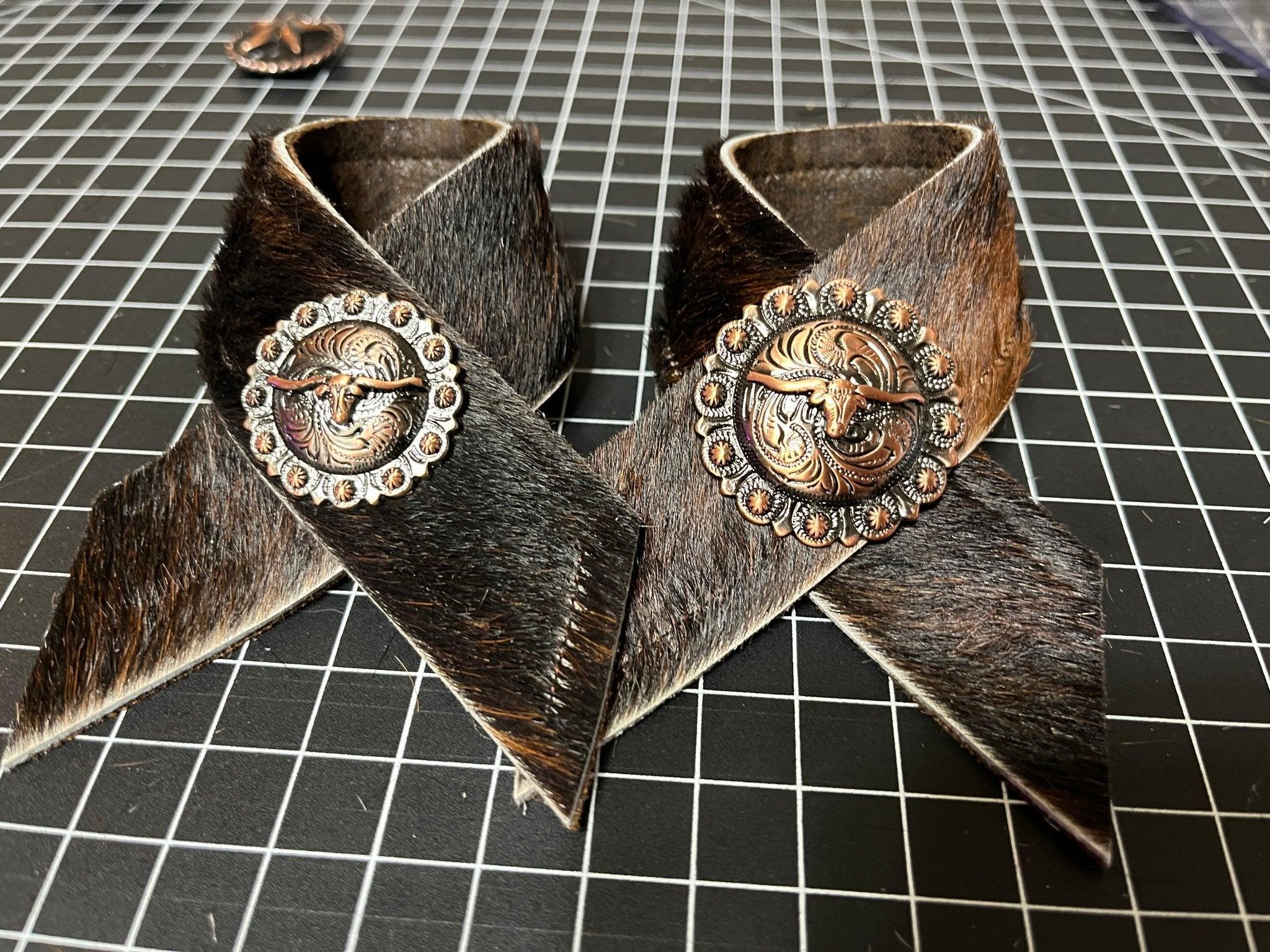 Brindle cowhide and longhorn concho napkin rings handmade in the USA by Your Western Decor