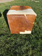 Brown and white cowhide cube ottoman 
