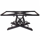 Black iron dining table base with a rectangular frame top and ornate scrollwork pedestal base, shown on a white background.