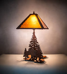 Table lamp with a bear and tree design on a neutral background