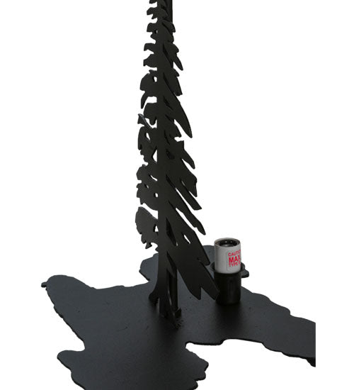 Close-up of black pine tree silhouette base on lone elk table lamp