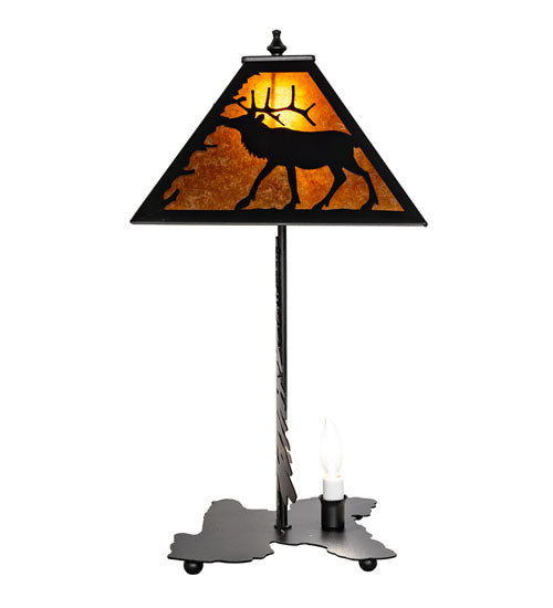 Side view of lone elk table lamp showing amber mica shade and pine tree base silhouette