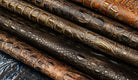 Close up of Midas Touch croc embossed leather collection with metallic highlights 