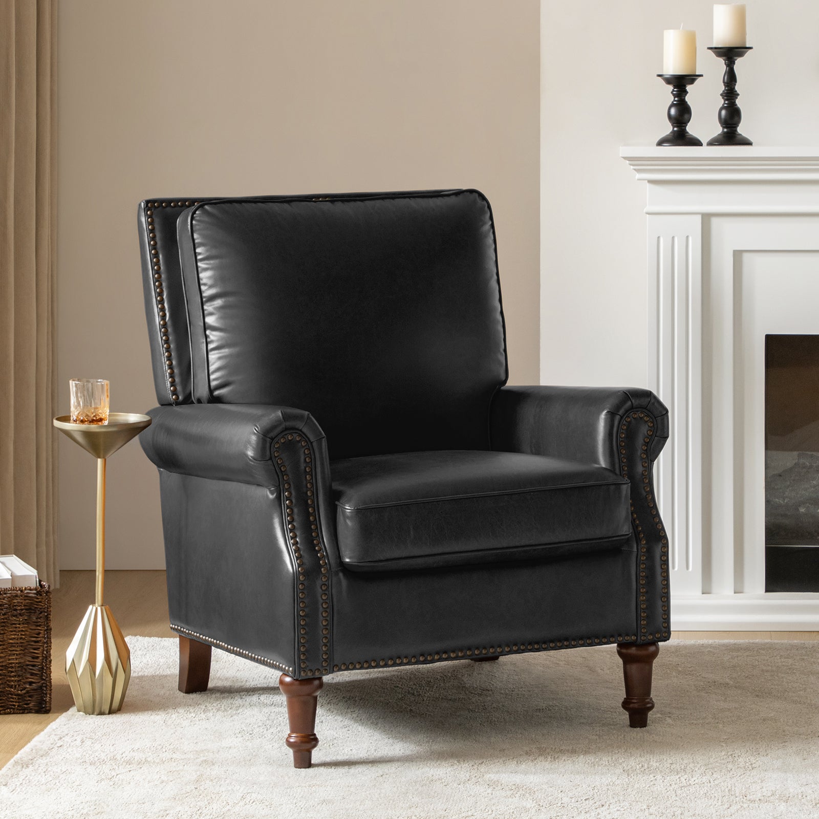 Midnight Canyon black leather chair styled in living room with fireplace, neutral rug and modern accent table