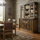 Dining room with wooden furniture and stone walls - Your Western Decor