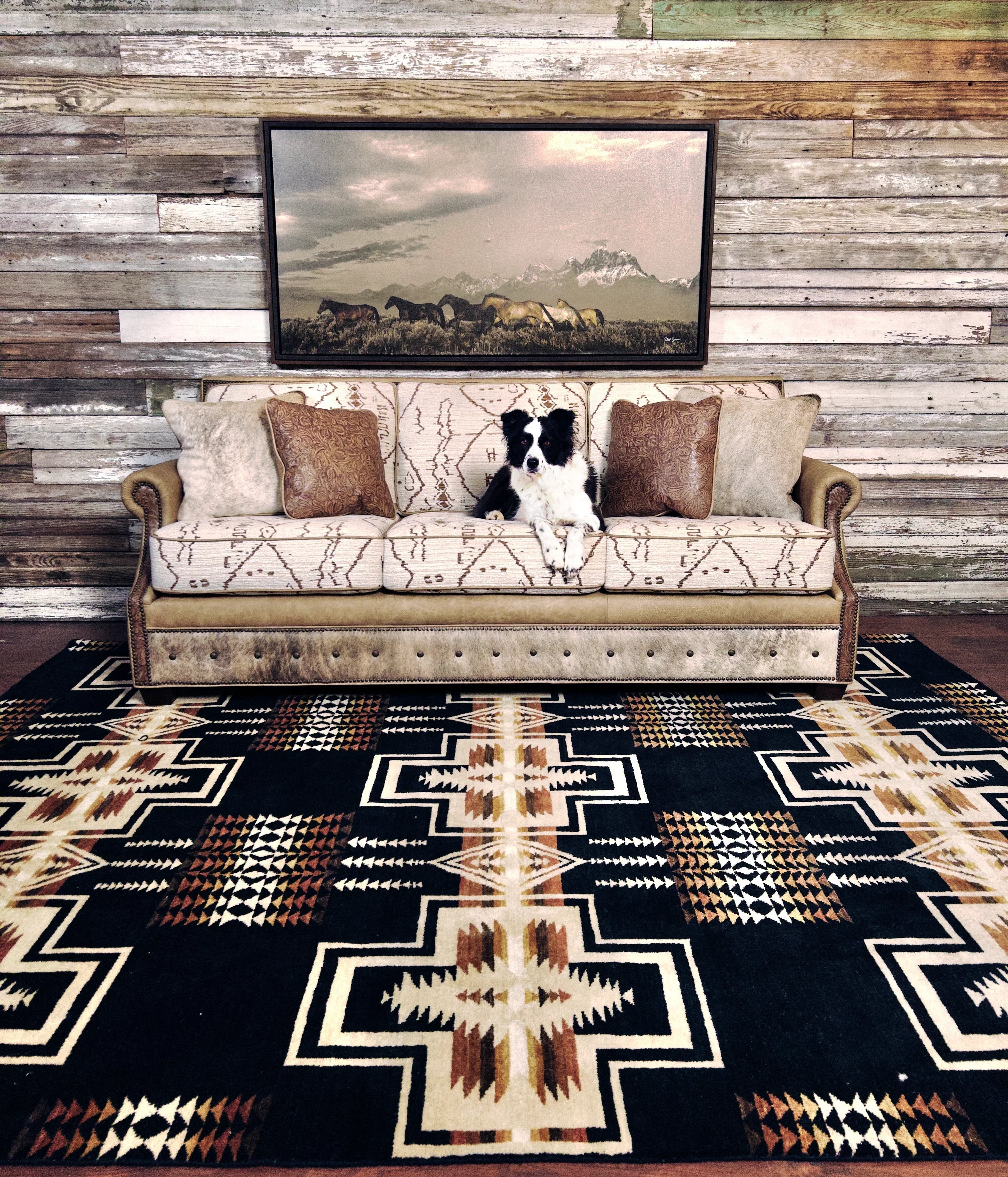 Mesa Southwestern sofa on Oxford Harding rug, horse art, and Border Collie laying on sofa