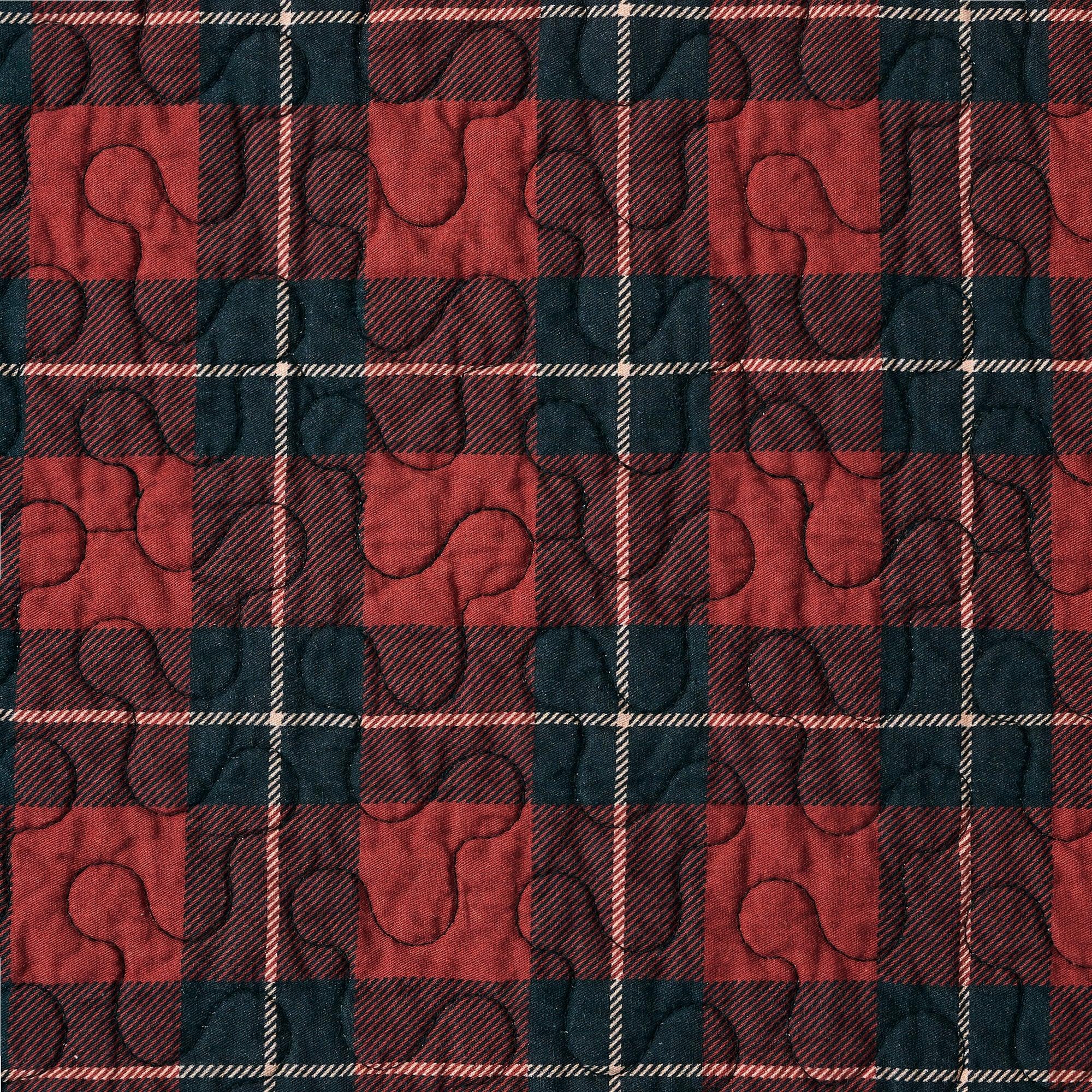 Red and black plaid pattern with quilted texture