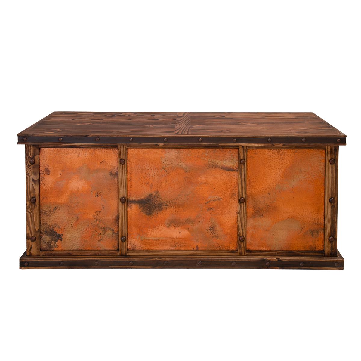 A rustic office desk with a dark brown wooden frame and three copper-paneled showing a textured, orange-toned patina, set against a plain white background.