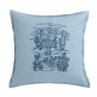 Blue pillow with desert landscape design featuring cacti and mountains on a white background