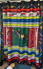 Colorful patterned shower curtain with a donkey design on a striped background.