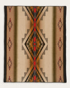 Decorative blanket with geometric pattern on a beige background