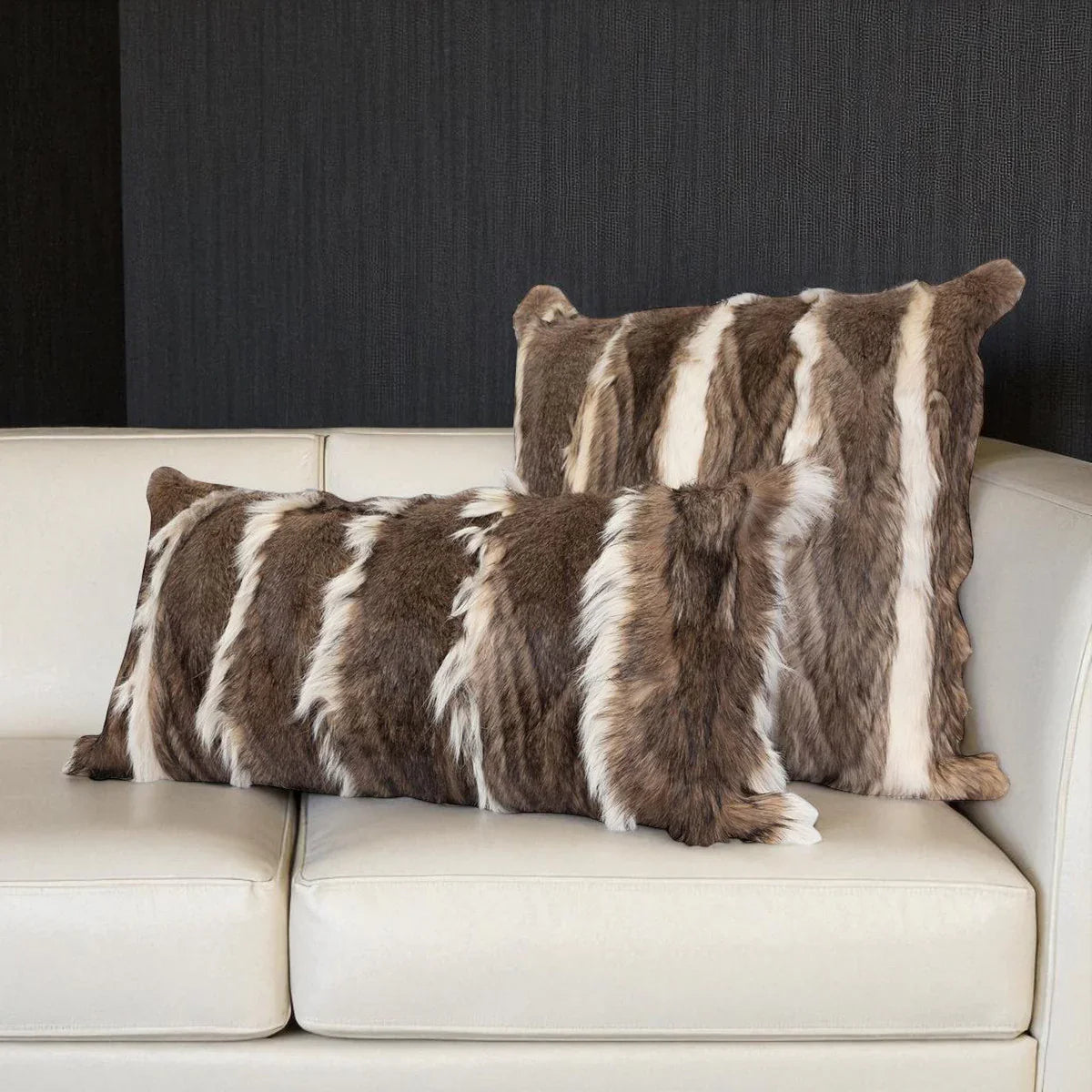 Genuine fur pillows in grey and ivory on Ivory leather sofa - Your Western Decor