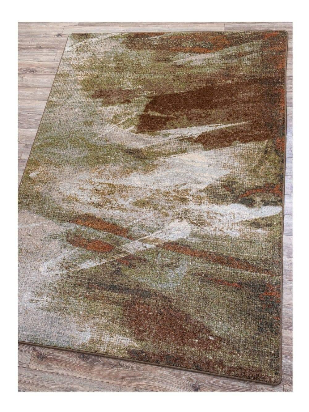 Wastelands Earth Area Rug in green, rust, and white on hardwood floor - Made in the USA