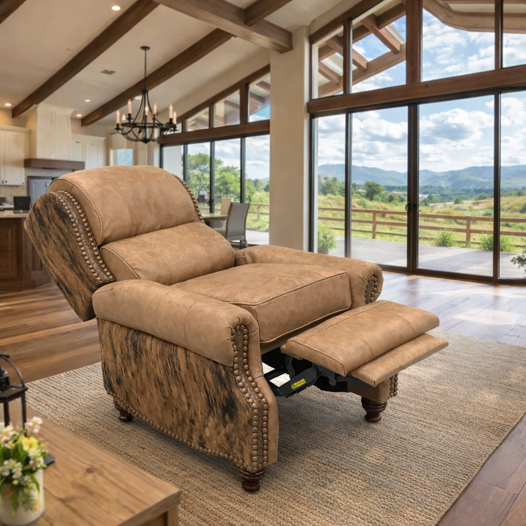 Western leather recliner with brindle cowhide panels in bright open ranch home with wood beams and floor-to-ceiling windows