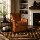Westfork Leather Swivel Chair in rich cognac leather styled in a warm transitional living room with natural light, hardwood floors, built-in shelving, and a southwestern area rug.