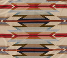 Authentic Pendleton® Wyeth Trails fabric featuring a Southwestern geometric pattern in ivory, red, blue, tan, and brown inspired by classic Western design.