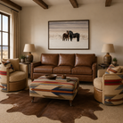 Western living room featuring the Wyeth Trails Swivel Chairs and matching ottoman upholstered in authentic Pendleton® fabric paired with a rich leather sofa.