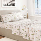 Bed with Gnome patterned holiday bedding in a bedroom setting