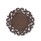 Decorative brown acanthus charger plate with intricate patterns on a white background