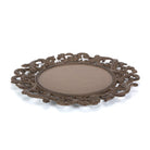 An ornate oval cast iron charger plate with a detailed scrollwork border and a smooth, matte brown center, shown on a plain white background.