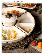 An off-white ceramic divided serving platter with a small lidded bowl, shown styled with food on a rustic wooden surface. The platter has a rope-like rim and is photographed in a warm, indoor setting with decorative vegetables and a dark carved tray underneath.
