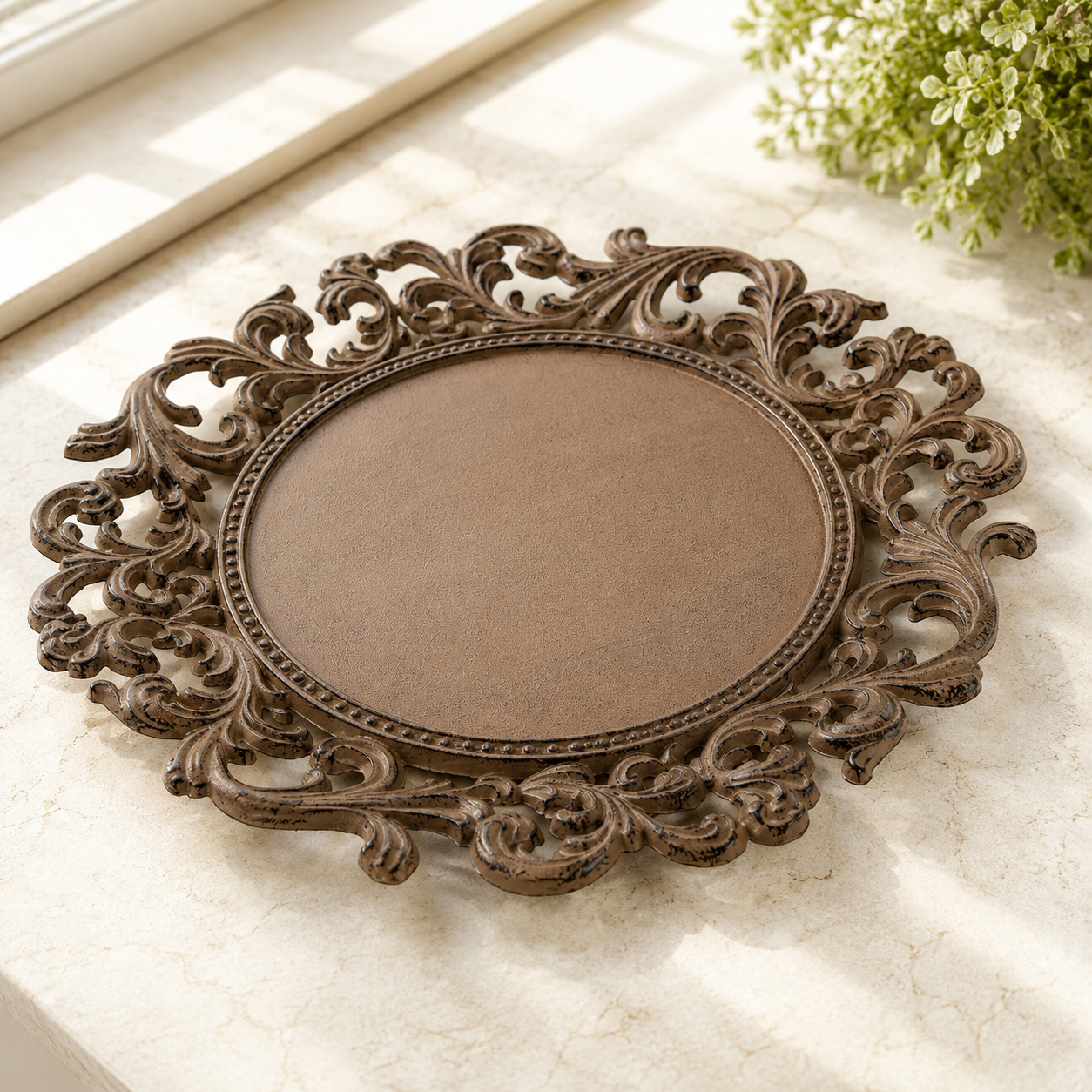 Acanthus Estate decorative cast iron charger plate with ornate acanthus leaf scrollwork.