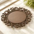 Acanthus Estate decorative cast iron charger plate with ornate acanthus leaf scrollwork.