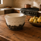 Cream stoneware embossed nesting bowls in cast stand with scrollwork design 